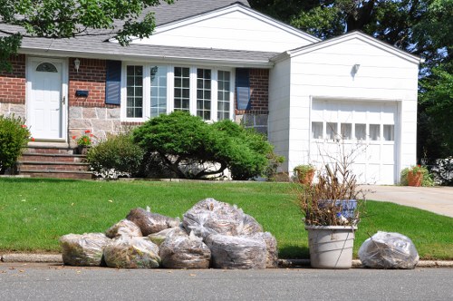 Team member preparing a home for clearance with clear signage visible